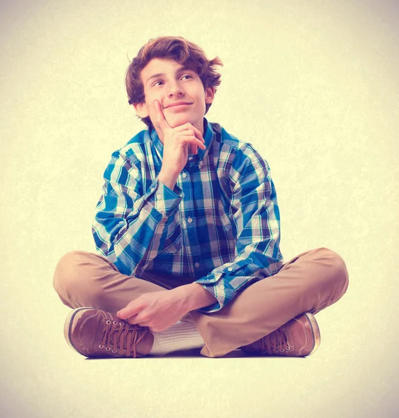 Teenager sitting thinking. isolated — Stock Photo, Image