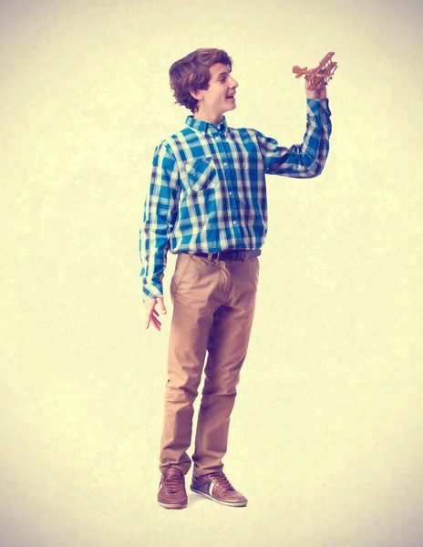 Teenager playing with wood plane — Stock Photo, Image