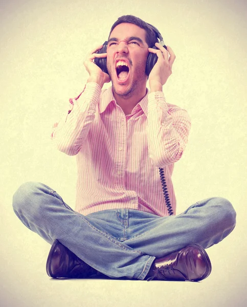 Young man shouting with headphones — Stock Photo, Image