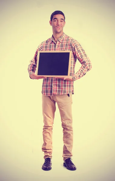 Young man with a blackboard — Stock Photo, Image