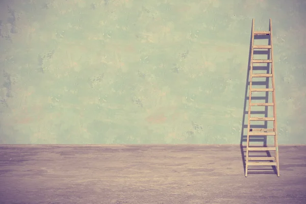 Ladder leaning against a wall — Stock Photo, Image