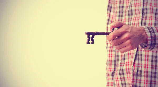 Hand holding a key — Stock Photo, Image