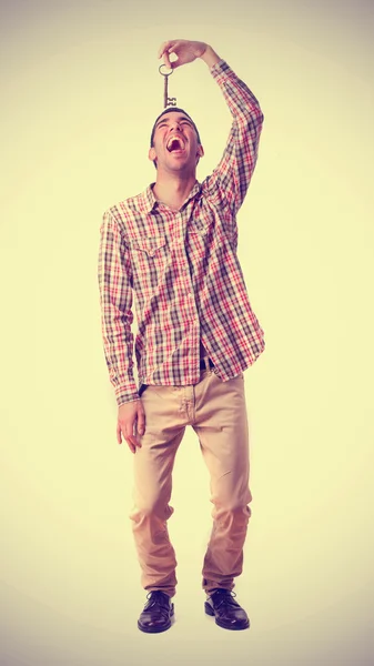 Boy swallowing a key — Stock Photo, Image