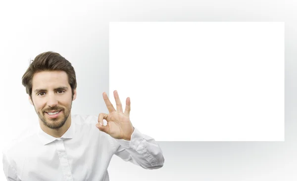 Young man on an empty frame background — Stock Photo, Image