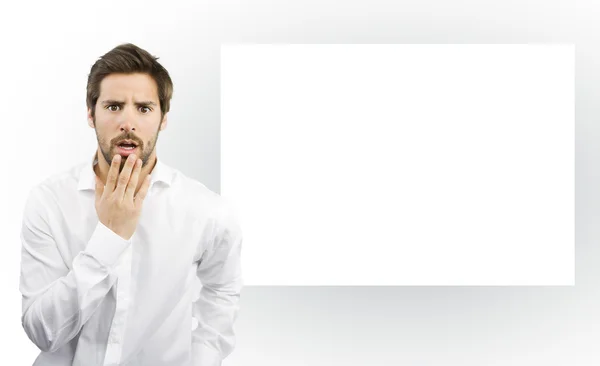 Surprised man on a canvas frame background — Stock Photo, Image