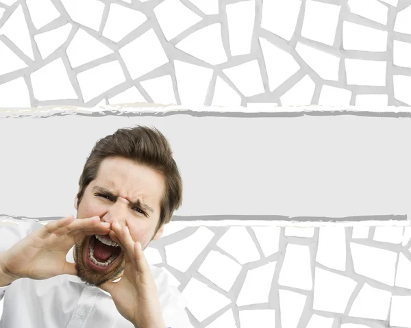 Man shouting over torn paper background — Stock Photo, Image