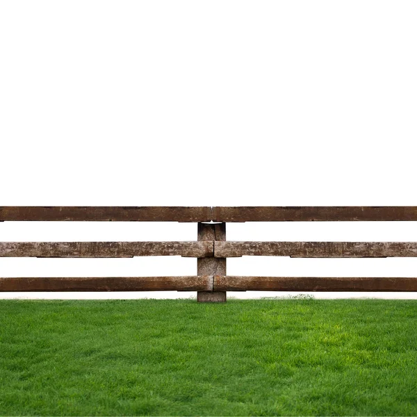 Wooden fence in green grass meadow — Stock Photo, Image