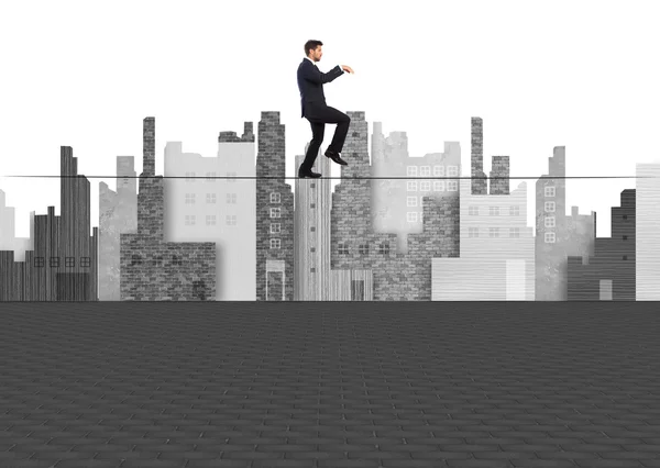 Businessman equilibrium on city background — Stock Photo, Image