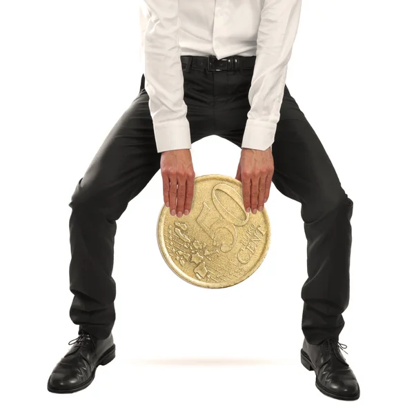 Empresario levantando una moneda de euro —  Fotos de Stock