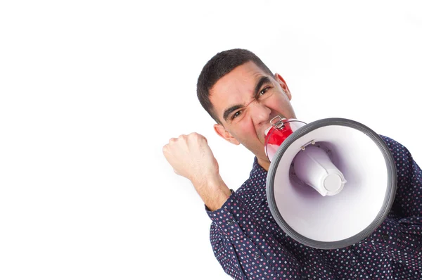 Young man shouting on a megaphone — Stock Photo, Image