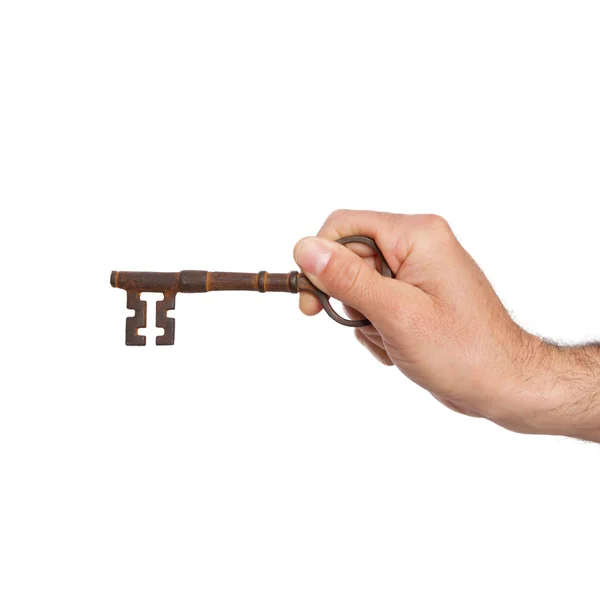Joven sosteniendo una llave — Foto de Stock
