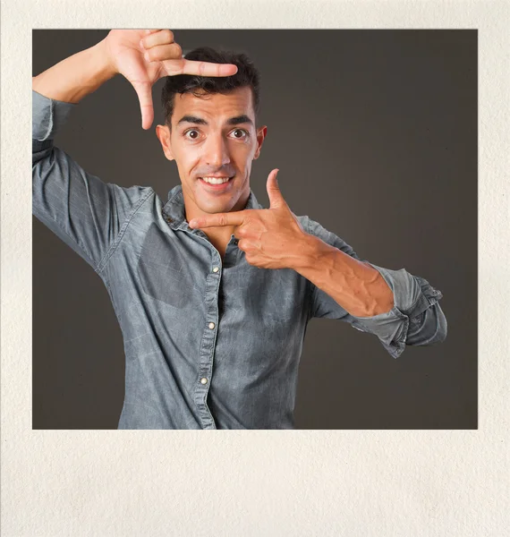 Young man frame gesture on photo frame — Stock Photo, Image