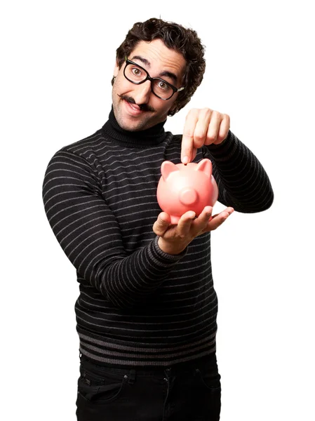 Pedantic man with a piggy bank — Stock Photo, Image