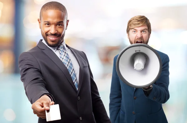 Young cool black man offering a credit card — Stock Photo, Image