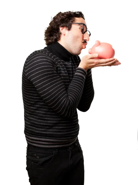 Pedantic man with a piggy bank — Stock Photo, Image