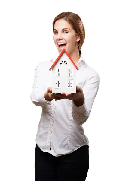 Blond woman with a small house — Stock Photo, Image