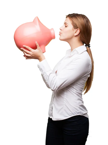 Blonde vrouw met een piggy bank — Stockfoto