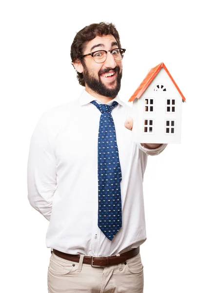 Zakenman met een huis — Stockfoto