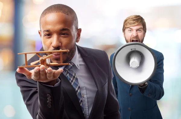 Young cool black man with wooden plane — Stock Photo, Image