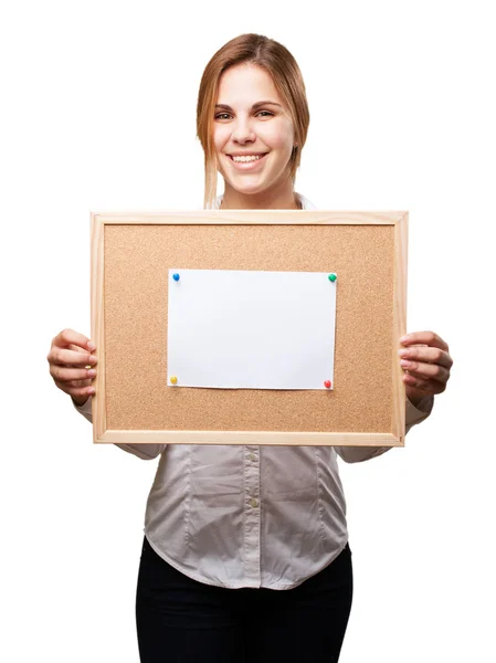 Blond woman with cork board — Stock Photo, Image