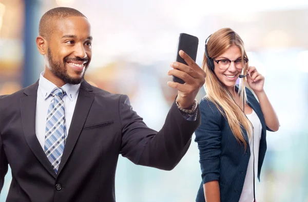 Young cool black man taking a picture with his phone — Stock Photo, Image