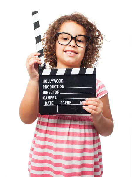 Negro chica con un clapperboard — Foto de Stock