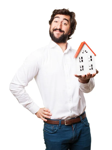 Man die een huis — Stockfoto