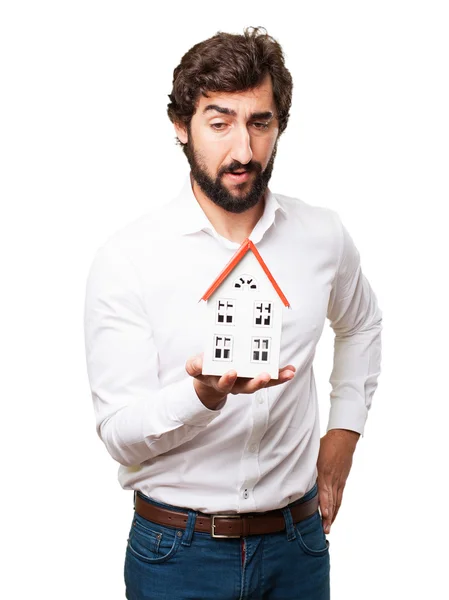 Man holding a house — Stock Photo, Image