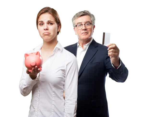 Blond woman with a piggy bank. sad sign — Stock Photo, Image