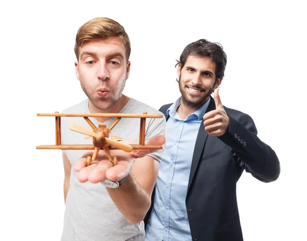 Blond man with wooden plane — Stock Photo, Image