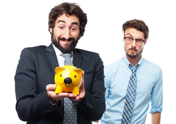 Businessman with a piggy bank — Stock Photo, Image