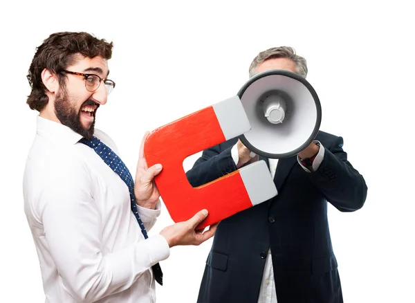 Businessman with magnet — Stock Photo, Image