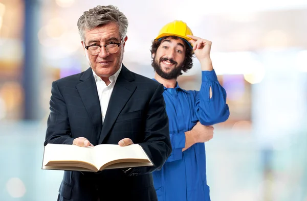 Senior cool man offering a book — Stock Photo, Image