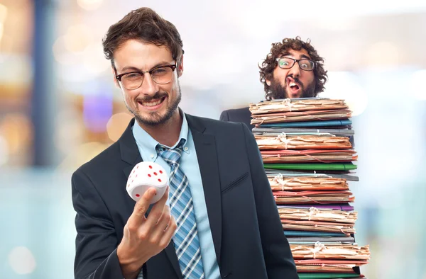 Young crazy businessman with a dice — Stock Photo, Image