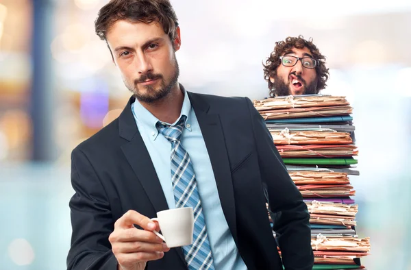 Молодой сумасшедший бизнесмен с кофе — стоковое фото