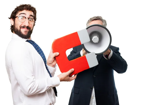 Businessman with magnet — Stock Photo, Image