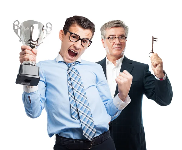 Businessman with a winner cup — Stock Photo, Image