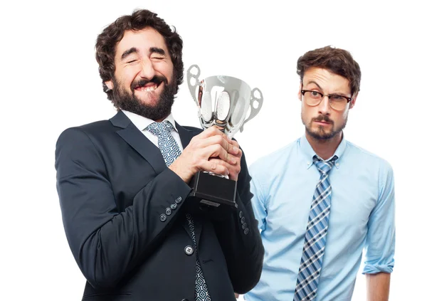 Hombre de negocios con una taza ganadora — Foto de Stock