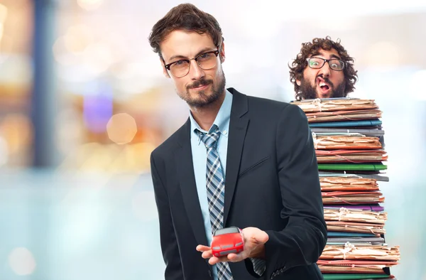 Young crazy businessman with a car toy — Stock Photo, Image