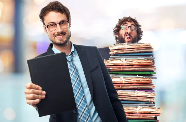 Jeune homme d'affaires fou avec un livre — Photo