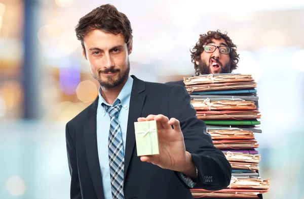 Young crazy businessman with a gift — Stock Photo, Image