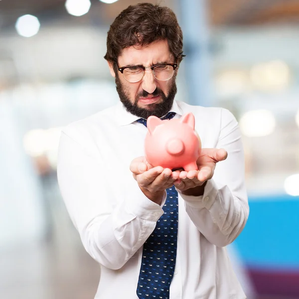 Hombre de negocios con alcancía — Foto de Stock