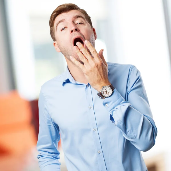 Blond man yawning — Stock Photo, Image