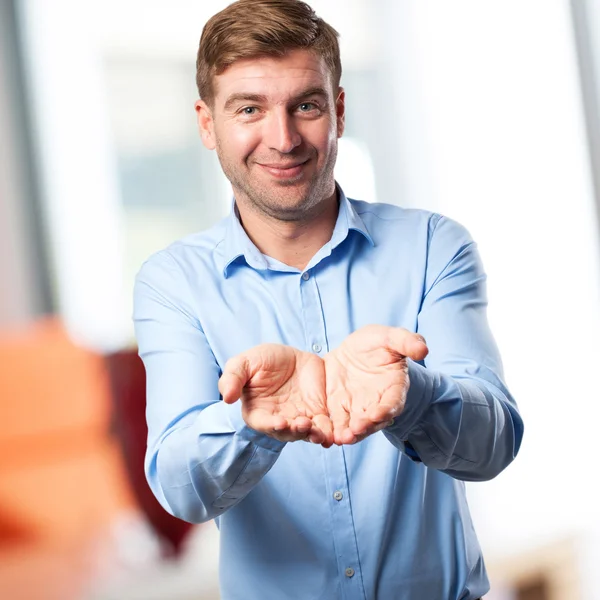 Blond man offering sign — Stock Photo, Image