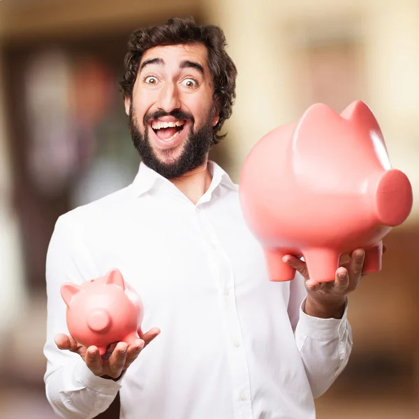 Homem com um banco porquinho — Fotografia de Stock