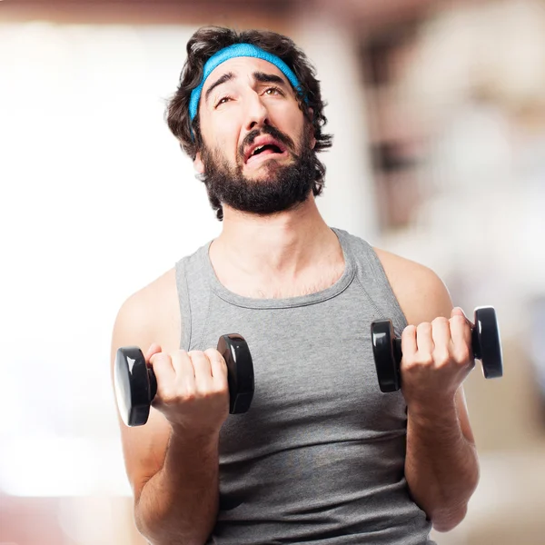 Crazy sportsman with dumbbells — Stock Photo, Image