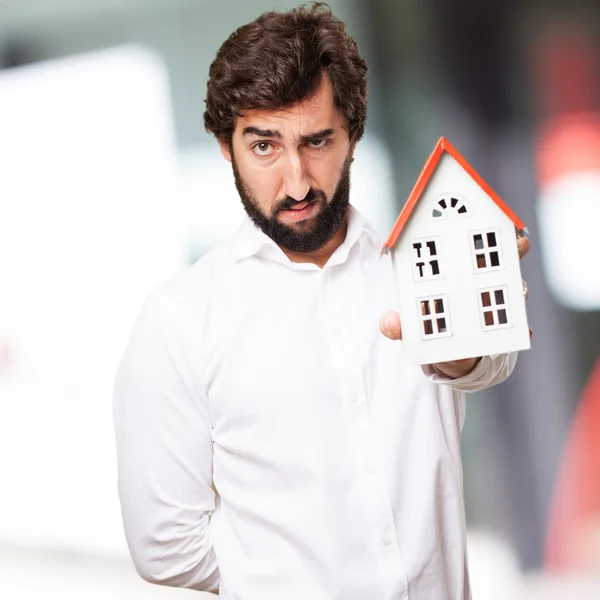 Man holding a house — Stock Photo, Image