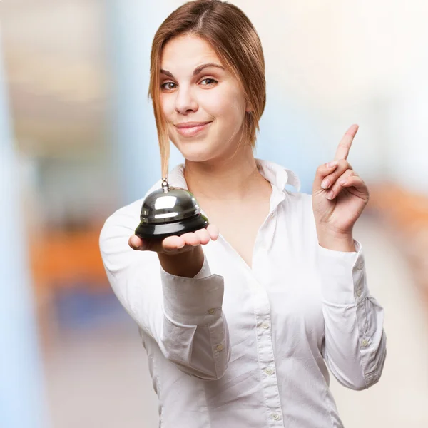 Blond woman with call bell — Stock Photo, Image