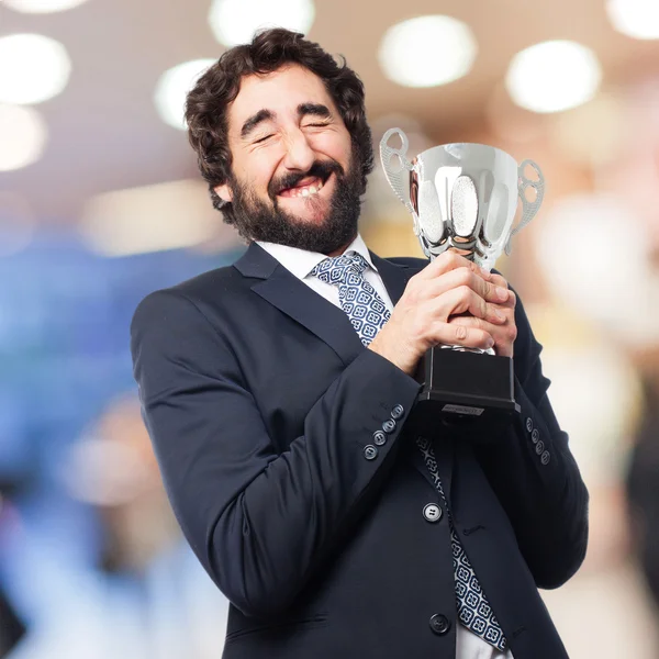 Hombre de negocios con una taza ganadora — Foto de Stock