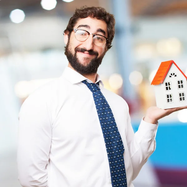 Businessman with a house — Stock Photo, Image